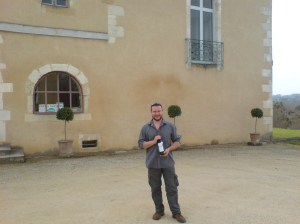 me outside Chateau Corbiac clutching a bottle of the 2004 red